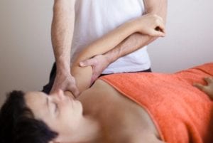 photo of woman getting therapeutic massage